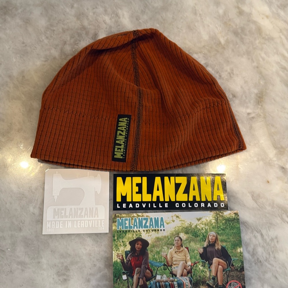 Melanzana "Pumpkin color" Adult medium Microgrid Hat. New with tags. M or W’s